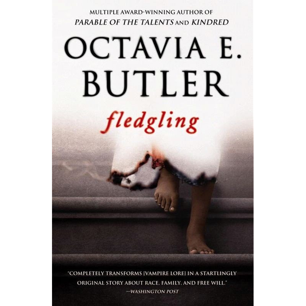 Book cover for Fledgling. The top half is white and fades into the feet of a Black girl descending some stairs. She appears to be wearing a white dress smoldering at the edges.